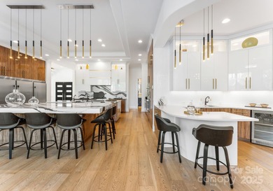 A one-of-a-kind modern masterpiece on Lake Norman. Crafted for on Trump National Golf Club Charlotte in North Carolina - for sale on GolfHomes.com, golf home, golf lot