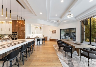 A one-of-a-kind modern masterpiece on Lake Norman. Crafted for on Trump National Golf Club Charlotte in North Carolina - for sale on GolfHomes.com, golf home, golf lot