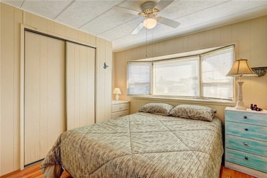 Cute and cozy fully furnished home offering relaxed on Barefoot Bay Golf Course in Florida - for sale on GolfHomes.com, golf home, golf lot