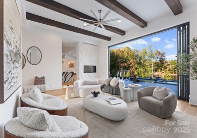 A one-of-a-kind modern masterpiece on Lake Norman. Crafted for on Trump National Golf Club Charlotte in North Carolina - for sale on GolfHomes.com, golf home, golf lot