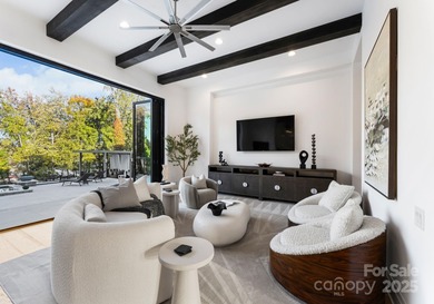A one-of-a-kind modern masterpiece on Lake Norman. Crafted for on Trump National Golf Club Charlotte in North Carolina - for sale on GolfHomes.com, golf home, golf lot