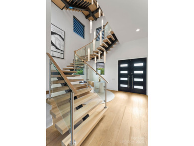 A one-of-a-kind modern masterpiece on Lake Norman. Crafted for on Trump National Golf Club Charlotte in North Carolina - for sale on GolfHomes.com, golf home, golf lot