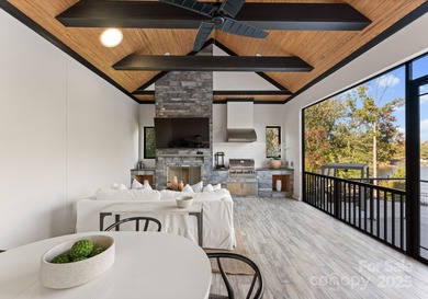 A one-of-a-kind modern masterpiece on Lake Norman. Crafted for on Trump National Golf Club Charlotte in North Carolina - for sale on GolfHomes.com, golf home, golf lot