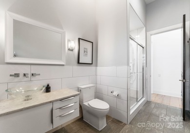 A one-of-a-kind modern masterpiece on Lake Norman. Crafted for on Trump National Golf Club Charlotte in North Carolina - for sale on GolfHomes.com, golf home, golf lot