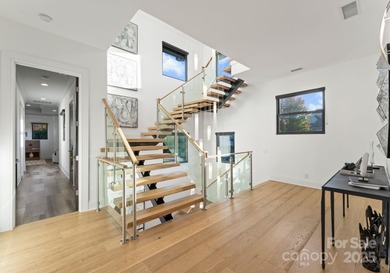 A one-of-a-kind modern masterpiece on Lake Norman. Crafted for on Trump National Golf Club Charlotte in North Carolina - for sale on GolfHomes.com, golf home, golf lot
