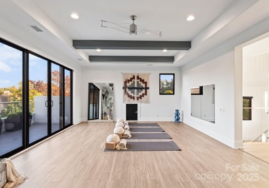 A one-of-a-kind modern masterpiece on Lake Norman. Crafted for on Trump National Golf Club Charlotte in North Carolina - for sale on GolfHomes.com, golf home, golf lot
