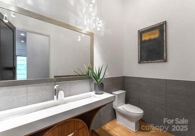 A one-of-a-kind modern masterpiece on Lake Norman. Crafted for on Trump National Golf Club Charlotte in North Carolina - for sale on GolfHomes.com, golf home, golf lot