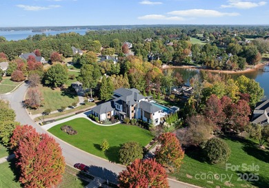 A one-of-a-kind modern masterpiece on Lake Norman. Crafted for on Trump National Golf Club Charlotte in North Carolina - for sale on GolfHomes.com, golf home, golf lot