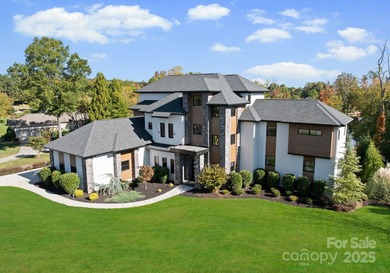 A one-of-a-kind modern masterpiece on Lake Norman. Crafted for on Trump National Golf Club Charlotte in North Carolina - for sale on GolfHomes.com, golf home, golf lot