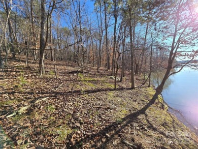 This Badin Lake waterfront lot is located in the prestigious on Old North State Club at Uwharrie Point Golf community in North Carolina - for sale on GolfHomes.com, golf home, golf lot