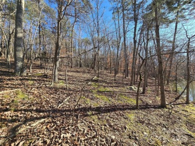 This Badin Lake waterfront lot is located in the prestigious on Old North State Club at Uwharrie Point Golf community in North Carolina - for sale on GolfHomes.com, golf home, golf lot