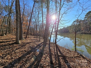 This Badin Lake waterfront lot is located in the prestigious on Old North State Club at Uwharrie Point Golf community in North Carolina - for sale on GolfHomes.com, golf home, golf lot