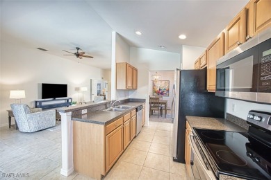 Welcome to your dream life-style in the prestigious Colonial on Colonial Country Club in Florida - for sale on GolfHomes.com, golf home, golf lot