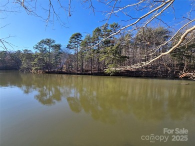 This Badin Lake waterfront lot is located in the prestigious on Old North State Club at Uwharrie Point Golf community in North Carolina - for sale on GolfHomes.com, golf home, golf lot