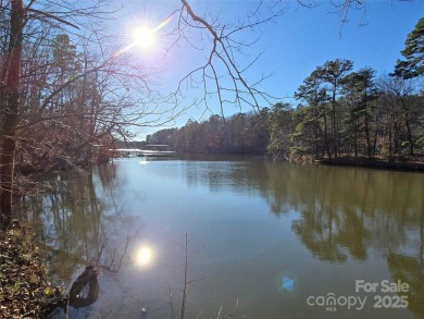 This Badin Lake waterfront lot is located in the prestigious on Old North State Club at Uwharrie Point Golf community in North Carolina - for sale on GolfHomes.com, golf home, golf lot