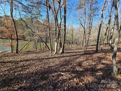 This Badin Lake waterfront lot is located in the prestigious on Old North State Club at Uwharrie Point Golf community in North Carolina - for sale on GolfHomes.com, golf home, golf lot