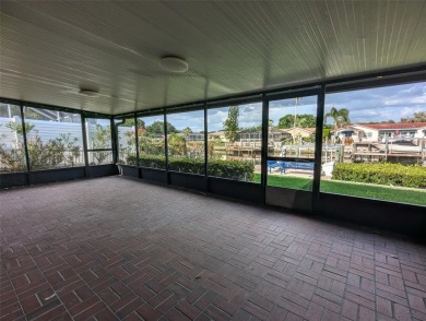 Under contract-accepting backup offers. Mid-century modern block on Rocky Point Golf Course in Florida - for sale on GolfHomes.com, golf home, golf lot
