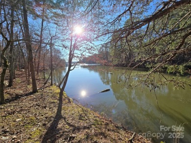 This Badin Lake waterfront lot is located in the prestigious on Old North State Club at Uwharrie Point Golf community in North Carolina - for sale on GolfHomes.com, golf home, golf lot