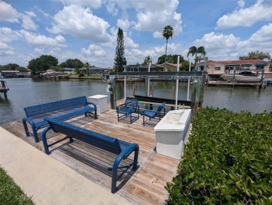 Under contract-accepting backup offers. Mid-century modern block on Rocky Point Golf Course in Florida - for sale on GolfHomes.com, golf home, golf lot