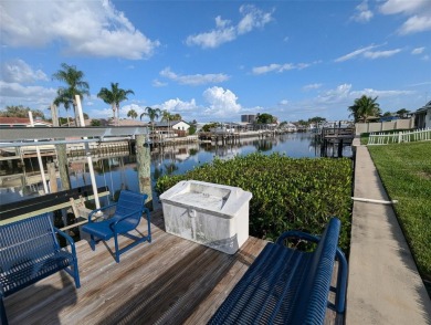 Under contract-accepting backup offers. Mid-century modern block on Rocky Point Golf Course in Florida - for sale on GolfHomes.com, golf home, golf lot