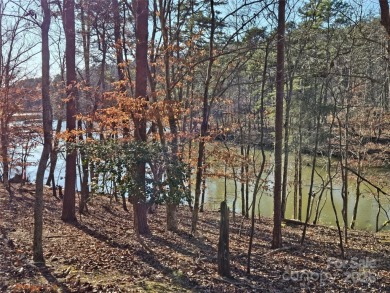 This Badin Lake waterfront lot is located in the prestigious on Old North State Club at Uwharrie Point Golf community in North Carolina - for sale on GolfHomes.com, golf home, golf lot