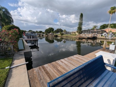 Under contract-accepting backup offers. Mid-century modern block on Rocky Point Golf Course in Florida - for sale on GolfHomes.com, golf home, golf lot