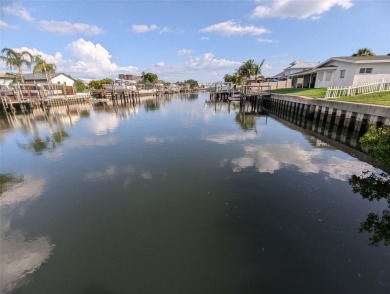 Under contract-accepting backup offers. Mid-century modern block on Rocky Point Golf Course in Florida - for sale on GolfHomes.com, golf home, golf lot