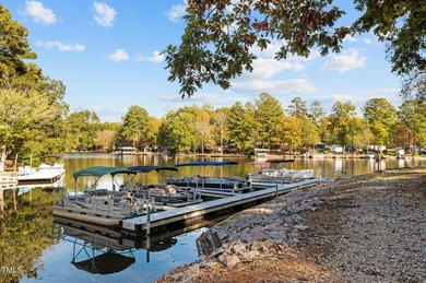 Car enthusiasts will love the detached, heated and cooled garage on River Golf and Country Club at Lake Royale in North Carolina - for sale on GolfHomes.com, golf home, golf lot