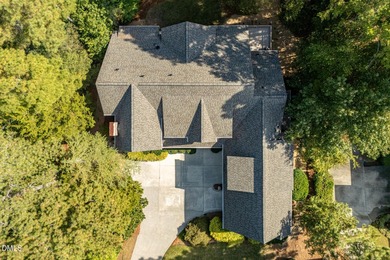 At the end of a quiet, wooded cul-de-sac in gated Governors on Governors Club in North Carolina - for sale on GolfHomes.com, golf home, golf lot