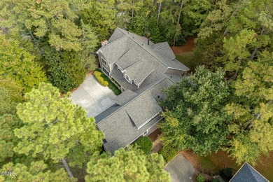 At the end of a quiet, wooded cul-de-sac in gated Governors on Governors Club in North Carolina - for sale on GolfHomes.com, golf home, golf lot