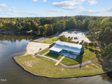 Car enthusiasts will love the detached, heated and cooled garage on River Golf and Country Club at Lake Royale in North Carolina - for sale on GolfHomes.com, golf home, golf lot