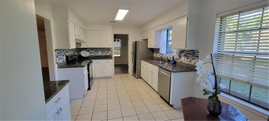 If you are looking for a 4-bedroom house with a large parking on Lake Forest Yacht and Country Club in Alabama - for sale on GolfHomes.com, golf home, golf lot