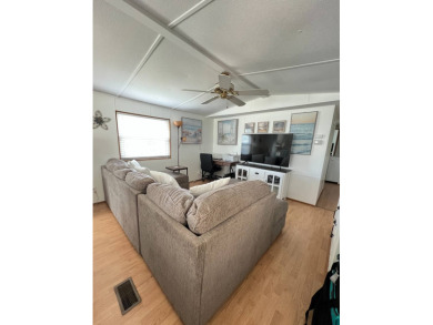This well maintained and beautifully furnished home, in active on Lake Henry Golf Club in Florida - for sale on GolfHomes.com, golf home, golf lot
