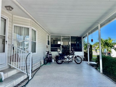 Lovely 2-bedroom, 2 bath home with 2 outdoor living spaces on Indianwood Golf and Country Club in Florida - for sale on GolfHomes.com, golf home, golf lot