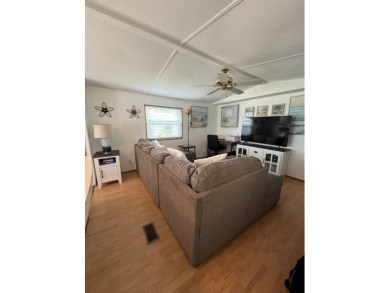 This well maintained and beautifully furnished home, in active on Lake Henry Golf Club in Florida - for sale on GolfHomes.com, golf home, golf lot