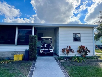 Lovely 2-bedroom, 2 bath home with 2 outdoor living spaces on Indianwood Golf and Country Club in Florida - for sale on GolfHomes.com, golf home, golf lot