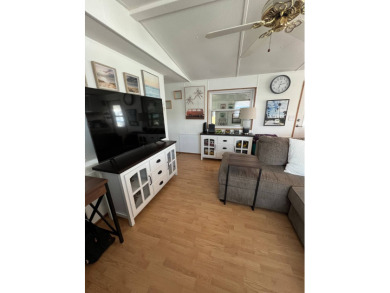 This well maintained and beautifully furnished home, in active on Lake Henry Golf Club in Florida - for sale on GolfHomes.com, golf home, golf lot