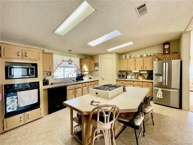 Lovely 2-bedroom, 2 bath home with 2 outdoor living spaces on Indianwood Golf and Country Club in Florida - for sale on GolfHomes.com, golf home, golf lot