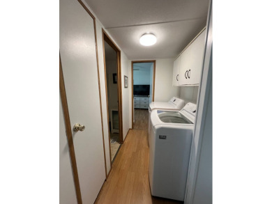 This well maintained and beautifully furnished home, in active on Lake Henry Golf Club in Florida - for sale on GolfHomes.com, golf home, golf lot