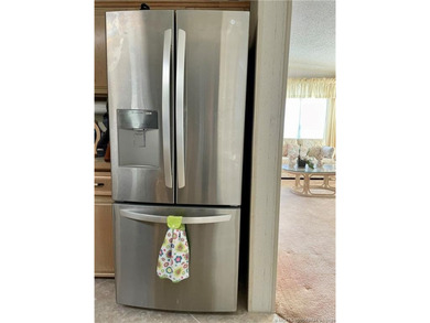 Lovely 2-bedroom, 2 bath home with 2 outdoor living spaces on Indianwood Golf and Country Club in Florida - for sale on GolfHomes.com, golf home, golf lot