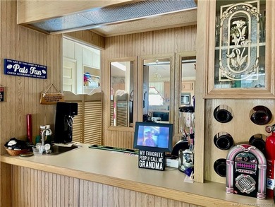 Lovely 2-bedroom, 2 bath home with 2 outdoor living spaces on Indianwood Golf and Country Club in Florida - for sale on GolfHomes.com, golf home, golf lot