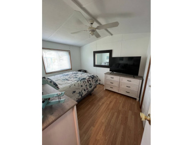 This well maintained and beautifully furnished home, in active on Lake Henry Golf Club in Florida - for sale on GolfHomes.com, golf home, golf lot
