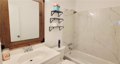 If you are looking for a 4-bedroom house with a large parking on Lake Forest Yacht and Country Club in Alabama - for sale on GolfHomes.com, golf home, golf lot