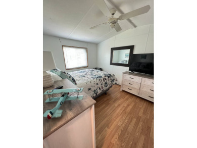 This well maintained and beautifully furnished home, in active on Lake Henry Golf Club in Florida - for sale on GolfHomes.com, golf home, golf lot