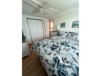 This well maintained and beautifully furnished home, in active on Lake Henry Golf Club in Florida - for sale on GolfHomes.com, golf home, golf lot