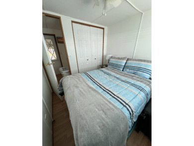 This well maintained and beautifully furnished home, in active on Lake Henry Golf Club in Florida - for sale on GolfHomes.com, golf home, golf lot