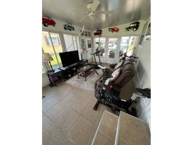 This well maintained and beautifully furnished home, in active on Lake Henry Golf Club in Florida - for sale on GolfHomes.com, golf home, golf lot