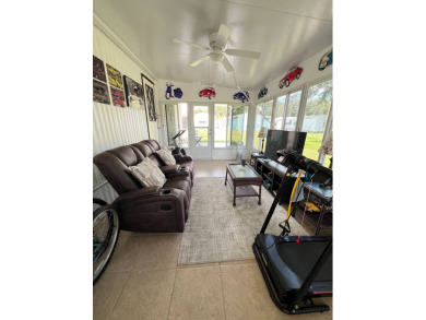 This well maintained and beautifully furnished home, in active on Lake Henry Golf Club in Florida - for sale on GolfHomes.com, golf home, golf lot