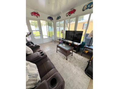 This well maintained and beautifully furnished home, in active on Lake Henry Golf Club in Florida - for sale on GolfHomes.com, golf home, golf lot