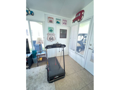 This well maintained and beautifully furnished home, in active on Lake Henry Golf Club in Florida - for sale on GolfHomes.com, golf home, golf lot
